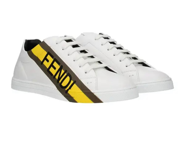 sneakers in white Diagonal stripe with brown and yellow logo.